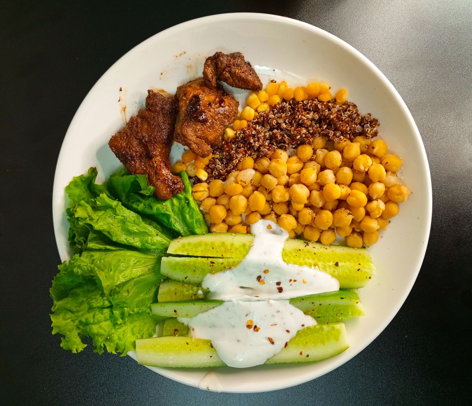 A balanced bowl with grains, chickpeas, and vegetables