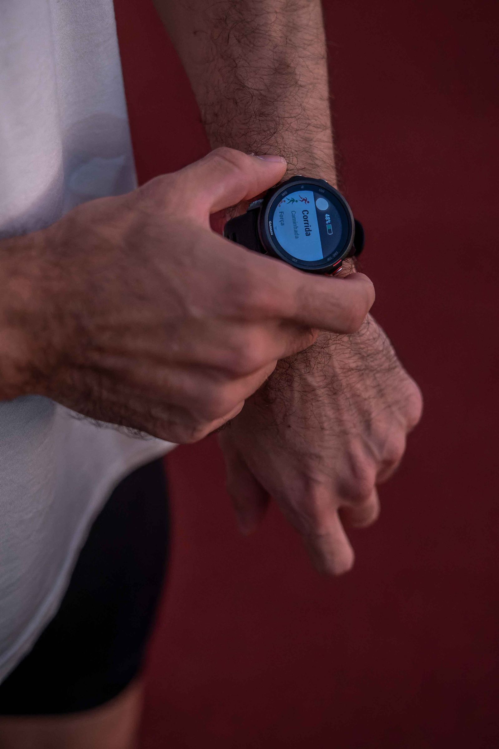 A runner reviewing a smartwatch after exercise