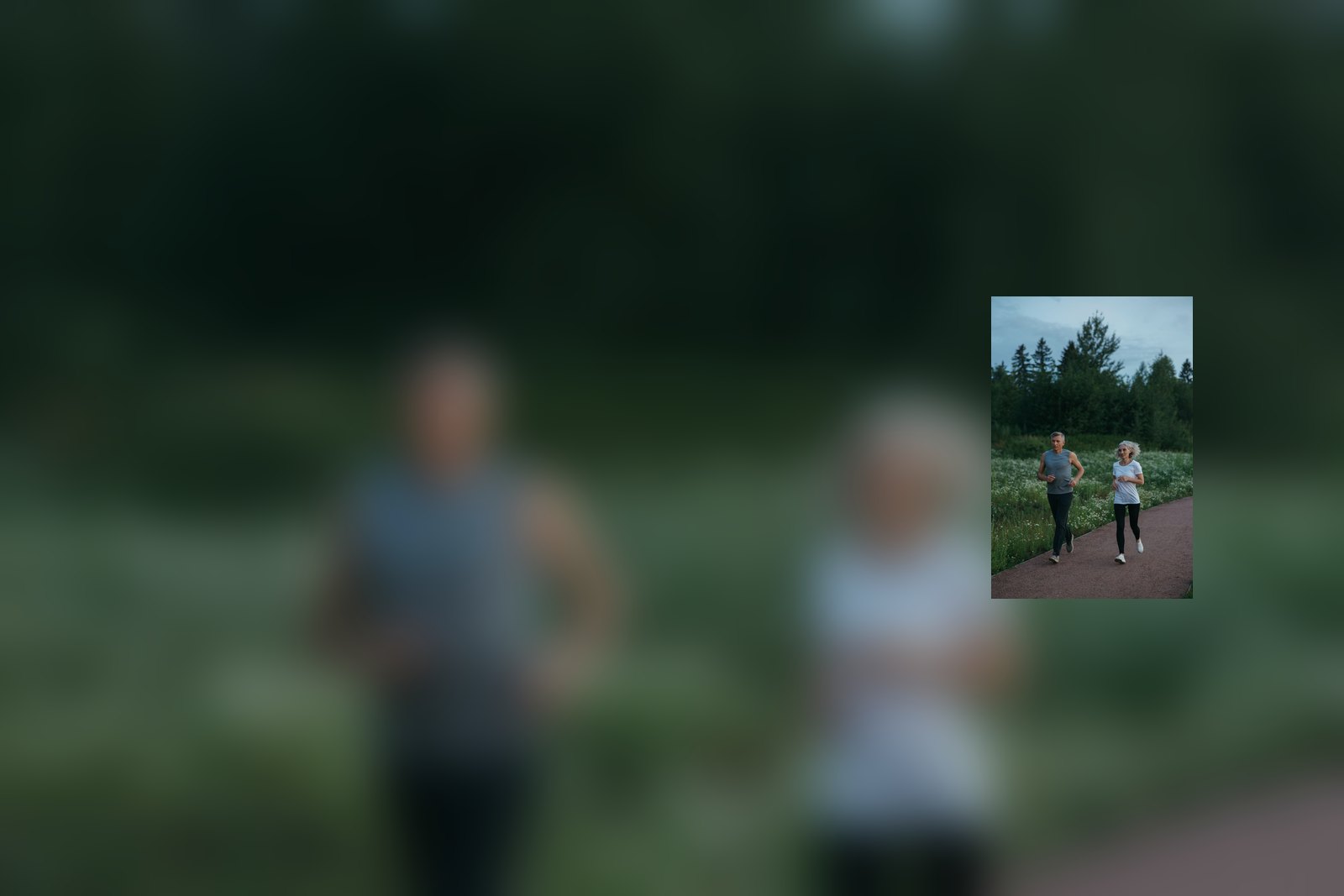 A couple jogging together on a park path